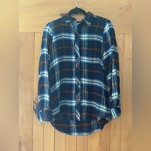 Plaid flannel button up shirt.